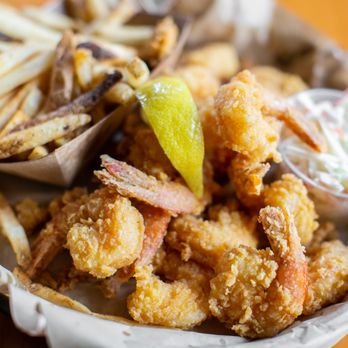 The Hideaway - a basket of fried shrimp and fries - American Near Me - Gulf Shores, Alabama The Hideaway - a basket of fried shrimp and fries - American Near Me - Gulf Shores, Alabama