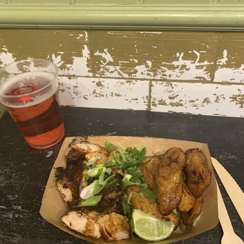 Boxpark Shoreditch - Jerk Chicken with plantains and a strawberry like cider on the side! - Shopping Centers Near Me - London, XGL Boxpark Shoreditch - Jerk Chicken with plantains and a strawberry like cider on the side! - Shopping Centers Near Me - London, XGL