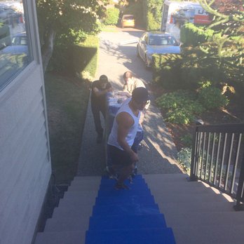 The Piano Movers - Tom handling the skid to get the piano down the front stairs. - Piano Services Near Me - North Vancouver, British Columbia The Piano Movers - Tom handling the skid to get the piano down the front stairs. - Piano Services Near Me - North Vancouver, British Columbia