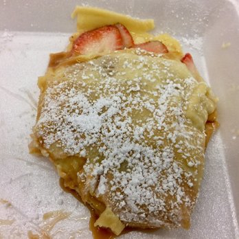 Island Crepes and Lemonade - my half eaten strawberry crepe with custard and caramel - Creperies Near Me - Honolulu, Hawaii