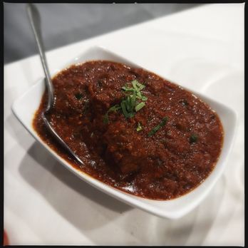 The Spice Room - Goat kohlapuri - choice of meat (chicken/lamb/goat) with roasted garam masala, coconut milk, curry leaves, and chili - Indian Near Me - Elmwood Park, New Jersey