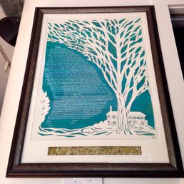 Our beautiful paper cut ketubah (https://www.etsy.com/shop/jerise) with a window for the broken glass from our wedding ceremony