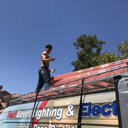 Next Level Lighting & Electric - Our tech Andrew showing off those muscles....
