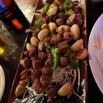 Cafe Princess Pig - Innards and garlic! Yummy!!! Flavors are spot on! - Bars Near Me - Honolulu, Hawaii