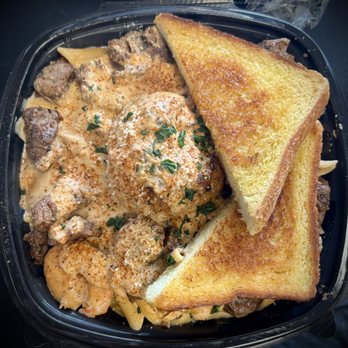 Streeters Acclaimed Kitchen - This was the daily special (lump crab cake, shrimp, and steak over pasta, with toast. - Chicken Wings Near Me - Jacksonville, Florida Streeters Acclaimed Kitchen - This was the daily special (lump crab cake, shrimp, and steak over pasta, with toast. - Chicken Wings Near Me - Jacksonville, Florida