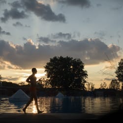 A guard makes quick last round before staff celebrated closing the pool for the season.