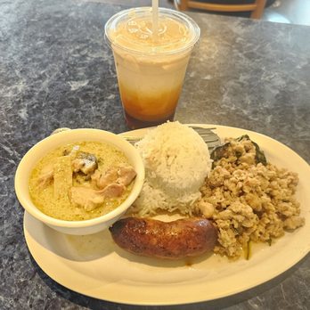 E-San Rod-Sap - Three item combo: Green Curry, Lao Sausage, and Basil Chicken ($10.50). Thai Tea ($4). 3/21/2026 - Thai Near Me - Anaheim, California