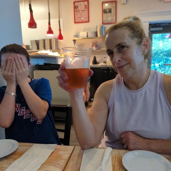 Off The Wall Tap House - Kelly enjoying Jade IPA! Reagan is always horrified! - American Near Me - Corolla, North Carolina Off The Wall Tap House - Kelly enjoying Jade IPA! Reagan is always horrified! - American Near Me - Corolla, North Carolina
