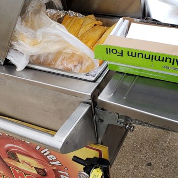 Get Them While They're Hot Tamales - a fire extinguisher next to a box of hot tamales - Mexican Near Me - Milwaukee, Wisconsin Get Them While They're Hot Tamales - a fire extinguisher next to a box of hot tamales - Mexican Near Me - Milwaukee, Wisconsin
