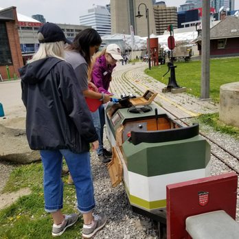 Roundhouse Park - Putting in gas into the miniature train. - Parks Near Me - Toronto, Ontario