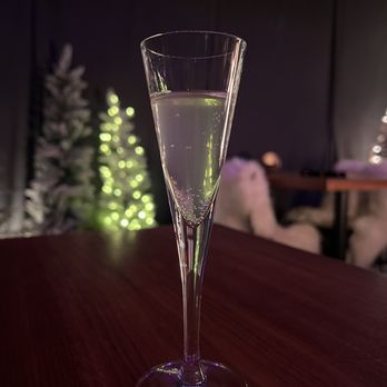 Beckon - a glass of wine on a table - New American Near Me - Denver, Colorado
