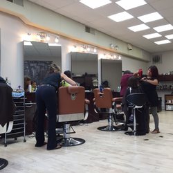 Village Custom Cuts - Great with kids! And I loved their haircuts. But they don't have the little cars and my son was a little disapointed about that.