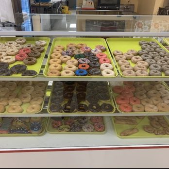 Eight Donuts - a variety of donuts on display - Donuts Near Me - Yukon, Oklahoma