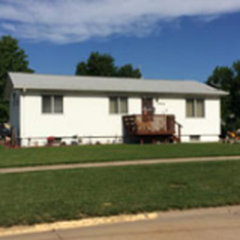 Malcom Roofing & General Contracting - a house with a flat roof - Roofing Near Me - Kearney, Nebraska Malcom Roofing & General Contracting - a house with a flat roof - Roofing Near Me - Kearney, Nebraska