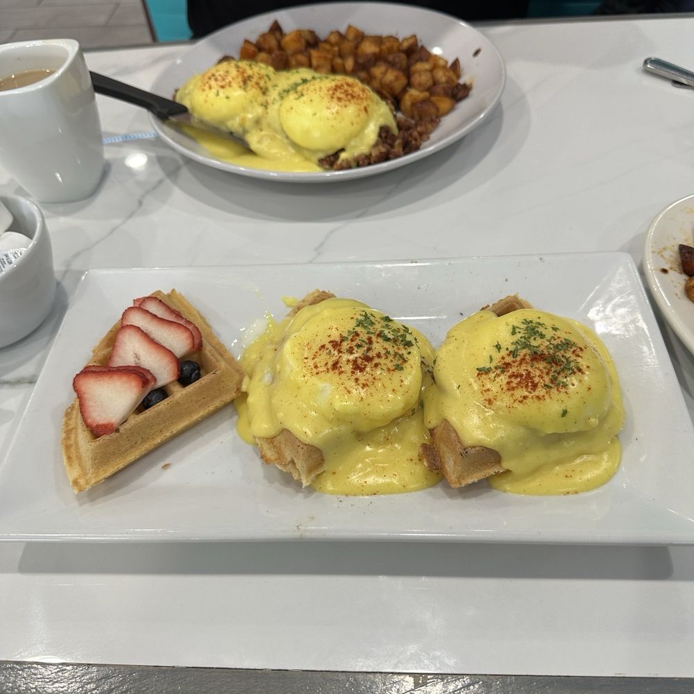 Mini gluten free waffles- 1 with fruit, 2 done eggs Benedict style. The hollandaise is amazing!