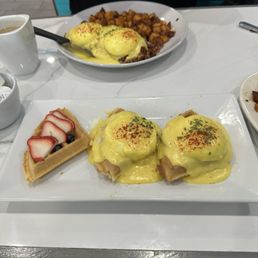 Mini gluten free waffles- 1 with fruit, 2 done eggs Benedict style. The hollandaise is amazing!