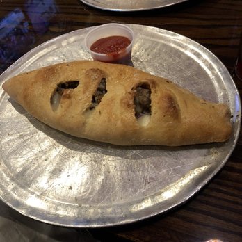 Mellow Mushroom Athens - Calzone and tiny marinara cup. - Pizza Near Me - Athens, Georgia Mellow Mushroom Athens - Calzone and tiny marinara cup. - Pizza Near Me - Athens, Georgia