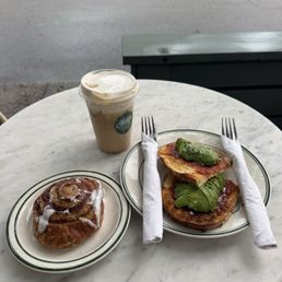 Avocado Toast and cinnamon roll and salted maple latte Avocado Toast and cinnamon roll and salted maple latte