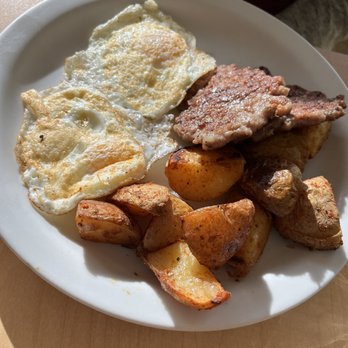 Sunny's - 2 eggs (perfect over easy), potatoes with homemade sausage, a must! - Coffee & Tea Near Me - Denver, Colorado Sunny's - 2 eggs (perfect over easy), potatoes with homemade sausage, a must! - Coffee & Tea Near Me - Denver, Colorado