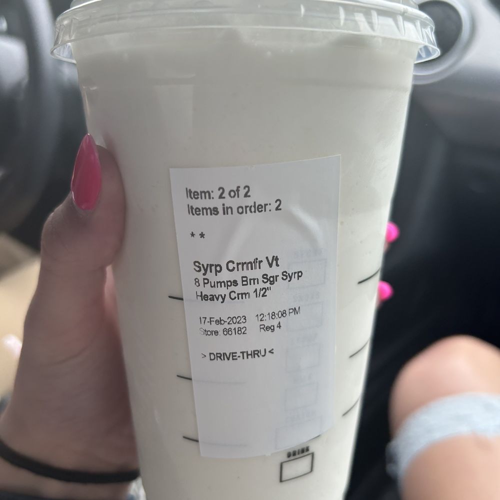 Starbucks - a person holding a cup of coffee - Coffee & Tea Near Me - Scottsboro, Alabama