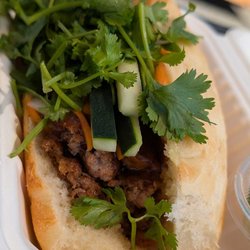 Grilled pork bahn mi - end shot so you can see the meat