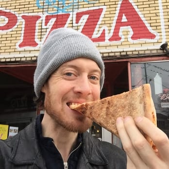 Grant Central Pizza - Myself enjoying a regular cheese slice topped with hot red pepper flakes. - Pizza Near Me - Atlanta, Georgia Grant Central Pizza - Myself enjoying a regular cheese slice topped with hot red pepper flakes. - Pizza Near Me - Atlanta, Georgia