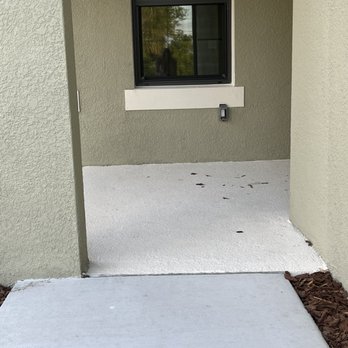 Neal Communities - Pillar in middle of sidewalk blocking walk and the outlet in trim vs over twelve inches where it is supposed to be. - Home Developers Near Me