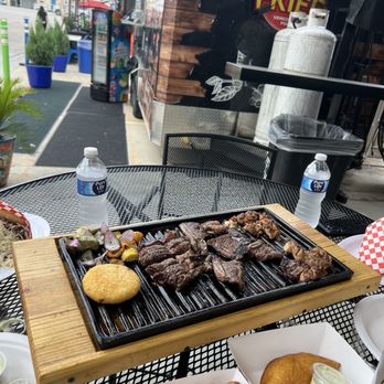 Papi's Woodfire Grill - Sizzling platter for 2. Chicken, spare ribs, etc. - Food Trucks Near Me - Magnolia, Texas Papi's Woodfire Grill - Sizzling platter for 2. Chicken, spare ribs, etc. - Food Trucks Near Me - Magnolia, Texas