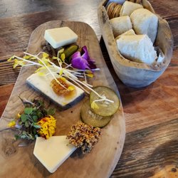 Bin + Board - Our cheese board with a boat of warm bread, crackers, and bread sticks