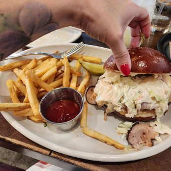 Culinary Dropout - Turkey Pastrami Sandwich on Pretzel Bun - New American Near Me - Austin, Texas Culinary Dropout - Turkey Pastrami Sandwich on Pretzel Bun - New American Near Me - Austin, Texas