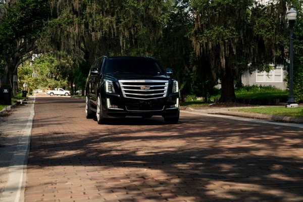 Ride in luxury all around Orlando! - Our late model Cadillac Escalade is heavily modified for your experience. More than luxury transportation, we will tailor your trip to become an integrated part of your day or evening.
Expect a higher standard than traditional car service, while we provide a truly unique and enthusiastic VIP treatment. Simplify your life with comfort and rest assured because Perfection Drives Us & You.
Inside the cabin you’ll find six industry leading LED luminaries outputting full spectrum color configurations, Bose surround system featuring dual 10-inch JL Audio subwoofers, premium sunroof, mirrored spacious and adjustable captain seats, impeccable climate control, device charging stations, and more. Ride in luxury all around Orlando! - Our late model Cadillac Escalade is heavily modified for your experience. More than luxury transportation, we will tailor your trip to become an integrated part of your day or evening.
Expect a higher standard than traditional car service, while we provide a truly unique and enthusiastic VIP treatment. Simplify your life with comfort and rest assured because Perfection Drives Us & You.
Inside the cabin you’ll find six industry leading LED luminaries outputting full spectrum color configurations, Bose surround system featuring dual 10-inch JL Audio subwoofers, premium sunroof, mirrored spacious and adjustable captain seats, impeccable climate control, device charging stations, and more.