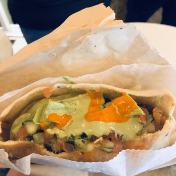 Falafel Inc - Falafel sandwich with sauces on top (added hummus for $1) - Falafel Near Me - Washington, DC, District of Columbia