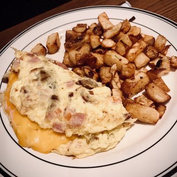 Mimi's Cafe - Ham, bacon and sausage omelette with a side of hash potatoes - Breakfast & Brunch Near Me - Reno, Nevada