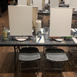 Wine and paint set up. Love how they label where to sit. Wine and paint set up. Love how they label where to sit.