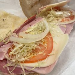 Capri Italian Food - Open view of a tasty smamich. Onions added at home.