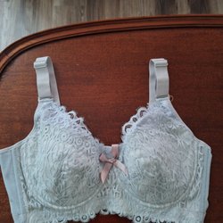 Belle Forme - A lacy blue pull on bra. With a pink bow in the middle.