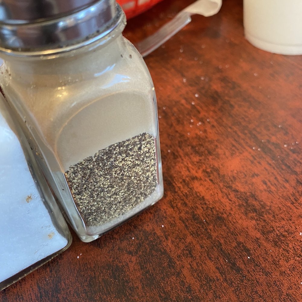 Howell's Western Cafe - Pepper shaker, greasy on the top, sides and unclean inside exposing years of it being refilled and not cleaned in between. - American Near Me - Springtown, Texas