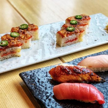 Miku - The Salmon Oshi sushi was excellent. A little smoky and perfectly flavored. Sushi nigiri - from left Maguro, unagi and hamachi. - Japanese Near Me - Vancouver, British Columbia
