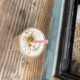 White chocolate pistachio iced latte with oat milk. White chocolate pistachio iced latte with oat milk.