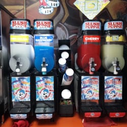 Jiffy Jim's - Frozen slush puppie pina colada, blue raspberry, cherry, and lemonade