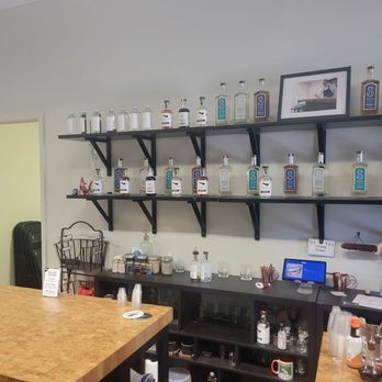 Shmidt Spirits - Front wall of the various spirits and differing stages of each process - Distilleries Near Me - Beltsville, Maryland