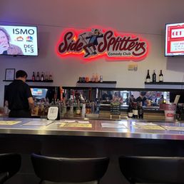 a bar with a neon sign
