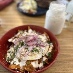 Alebrijes Cafe & Grill - Alebrijes chilaquiles salsa roja, shredded chicken and eggs