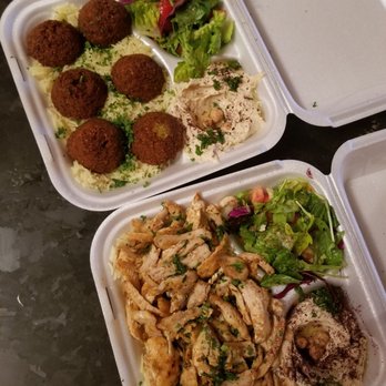 Zayna Mediterranean Grill - Falafel plate (top) and chicken shawarma plate (bottom) both served with salad, hummus, 1 whole pita, and on a bed of rice. - Mediterranean Near Me - Chicago, Illinois