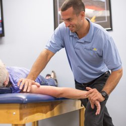 Atlantic Physical Therapy Center - Patient gets a gentle stretch from PT, DPT Chris MacIntosh at the Freehold Atlantic Physical Therapy Center location