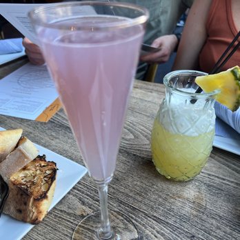 Salt & Stone - Lavender mimosa (front) mock tail (back) - Seafood Near Me - Somerville, Massachusetts