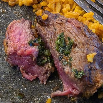 Inka Grill - The juicy medium rare steak from the Bistec a lo Pobre main entrée. - Peruvian Near Me - Roanoke, Virginia Inka Grill - The juicy medium rare steak from the Bistec a lo Pobre main entrée. - Peruvian Near Me - Roanoke, Virginia