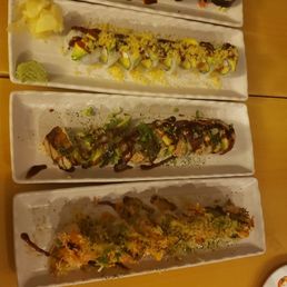 a variety of sushi on a long platter a variety of sushi on a long platter