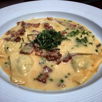 Bistro 135 - Smoked bacon and ricotta stuffed hand made ravioli, bacon cream sauce, topped with fresh bacon pieces and basil. AMAZING - Italian Near Me - Tracy, California