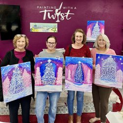 Painting with a Twist - My sisters and I with our finished paintings.